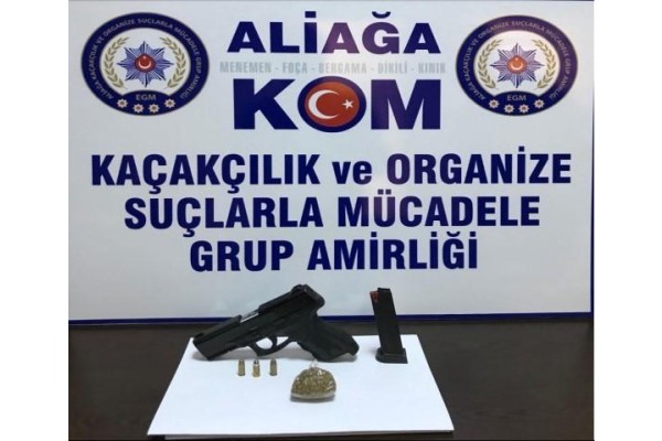 ÜZERİNDE SİLAH VE UYUŞTURUCUYLA POLİSE YAKALANDI